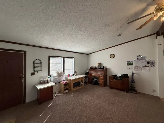 a bed room with furniture and a window
