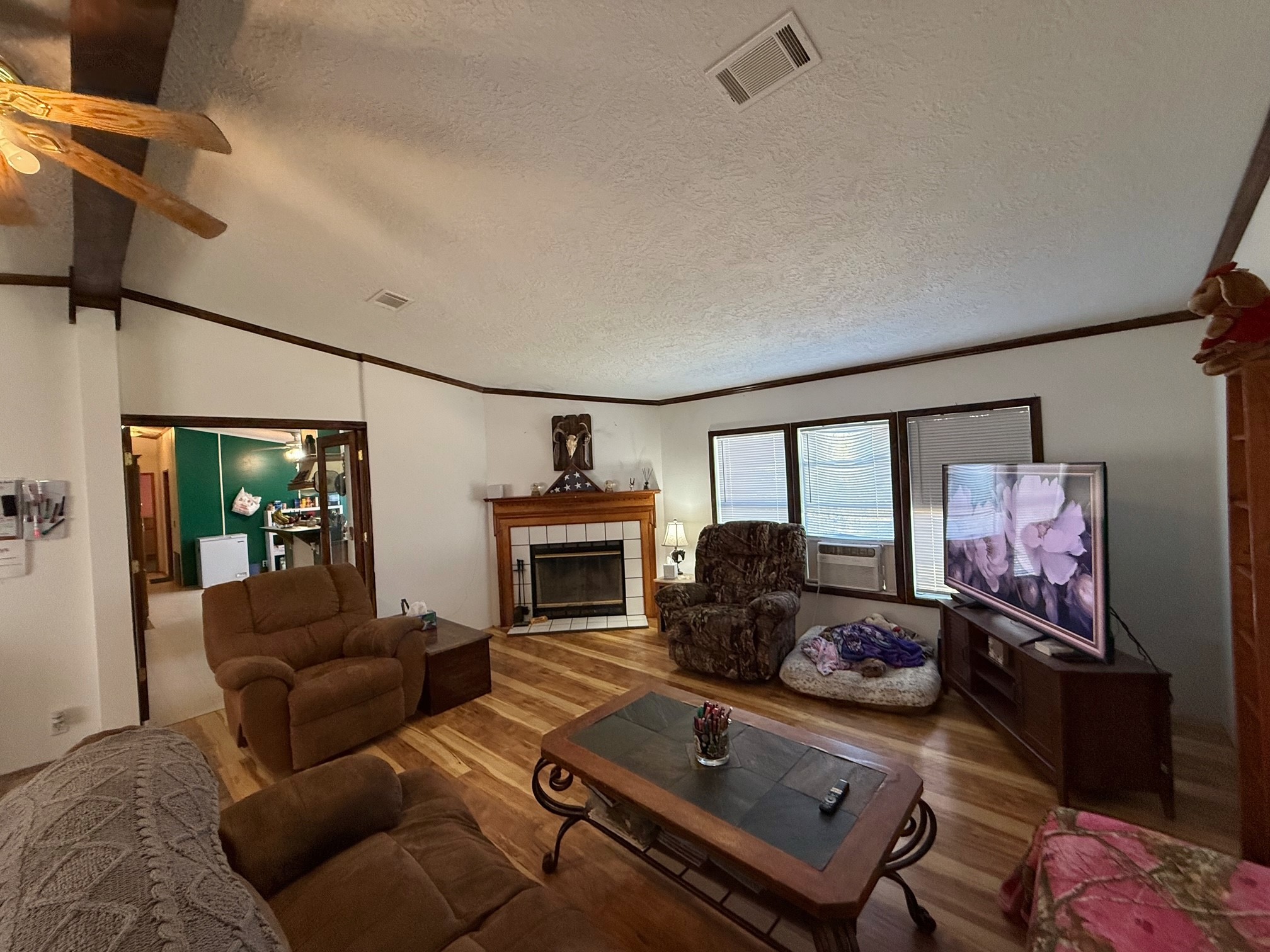 20197 Interstate 45 Buffalo, TX 75831 - Photo 5 of 30 a living room with furniture gym equipment and a fireplace