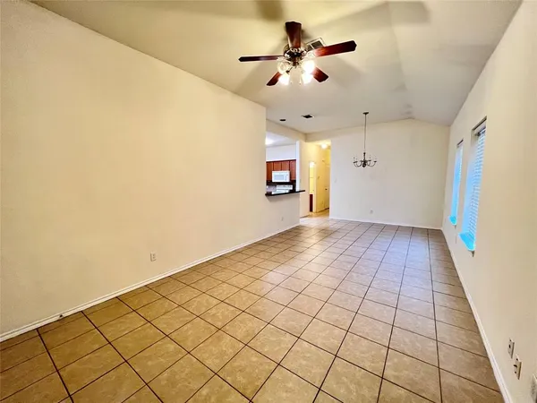 a view of an empty room and a window
