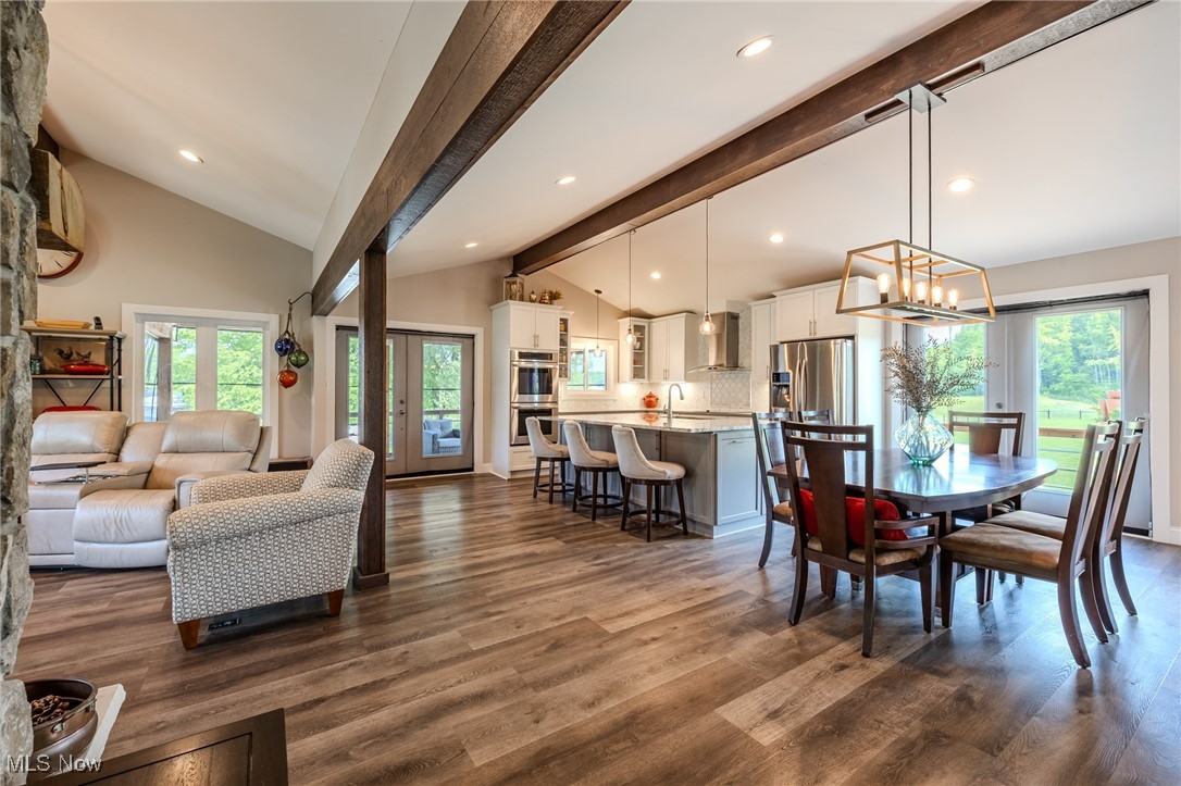 6268 Summers Road Windsor, OH 44099 - Photo 14 of 49 Dining space featuring healthy amount of natural light, dark wood-style flooring, a chandelier, and recessed lighting