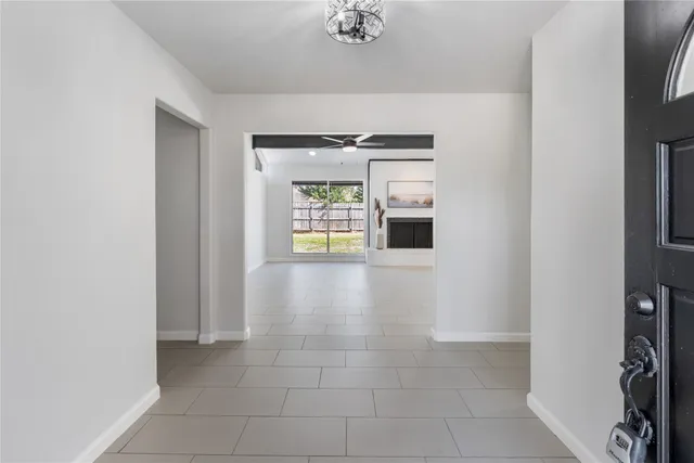 a view of an entryway with wooden floor