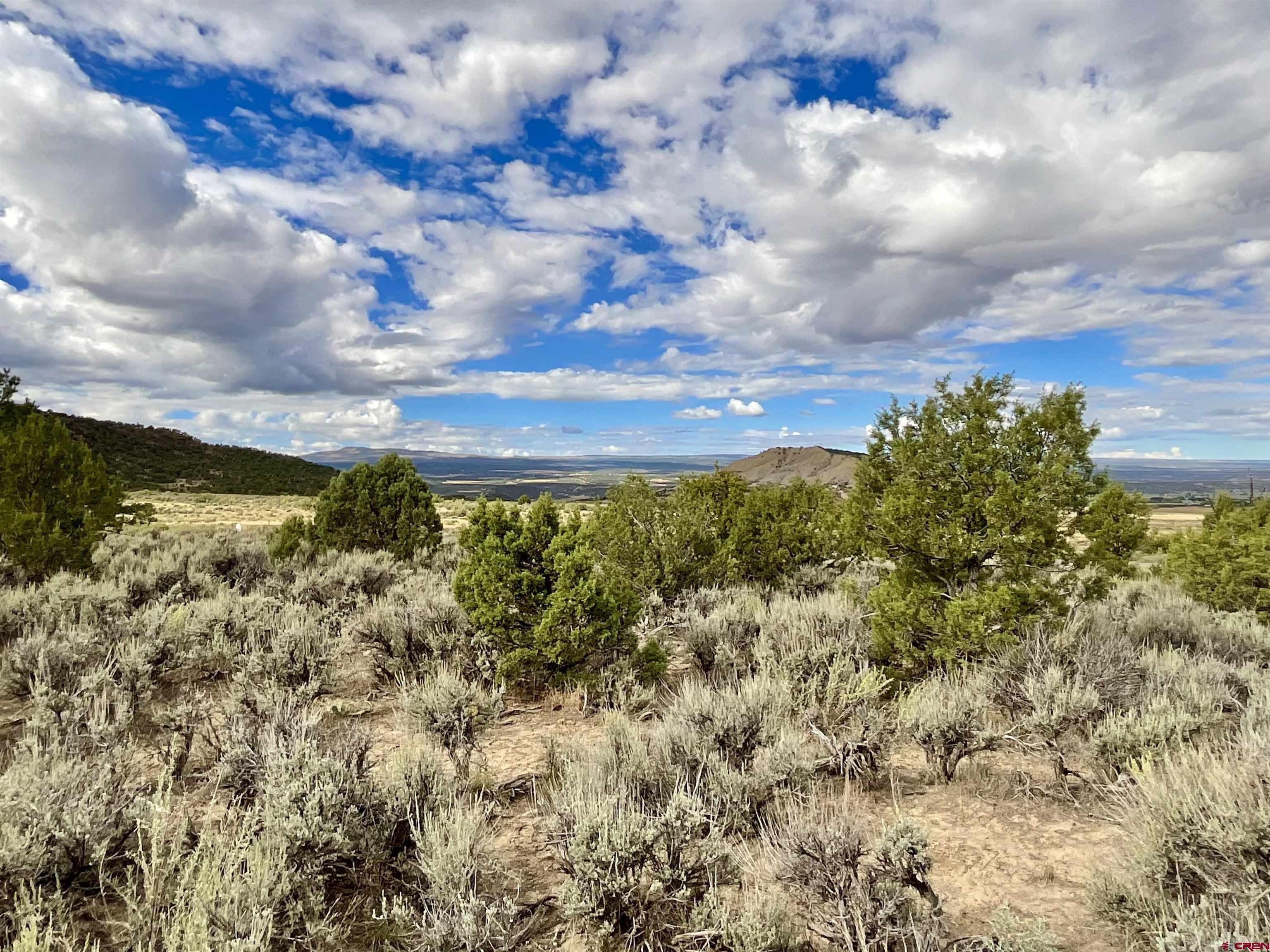 Tbd Lot 22 7250th Road Montrose, CO 81403 - Photo 6 of 25 a view of a lake with houses