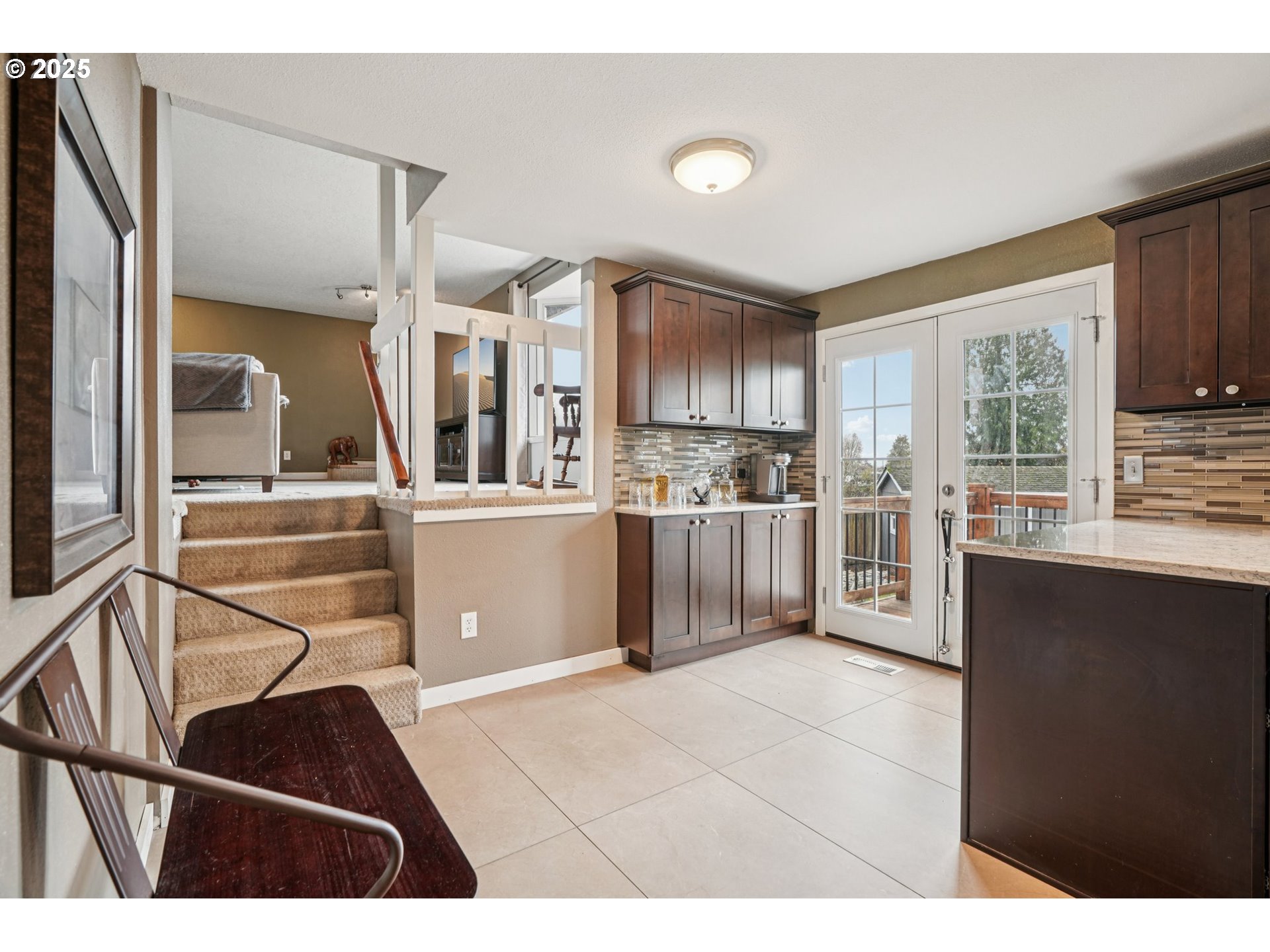 1832 Vine Court Forest Grove, OR 97116 - Photo 12 of 37 a kitchen with stainless steel appliances kitchen island granite countertop a refrigerator a stove top oven and a sink with granite countertops