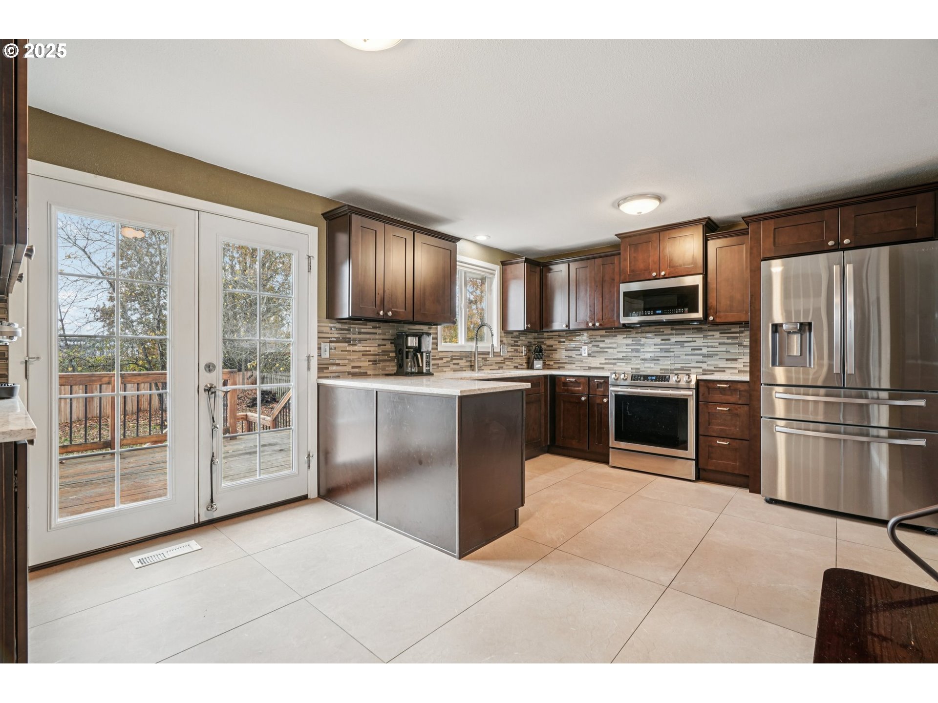 1832 Vine Court Forest Grove, OR 97116 - Photo 15 of 37 a kitchen with stainless steel appliances granite countertop a refrigerator and a stove top oven
