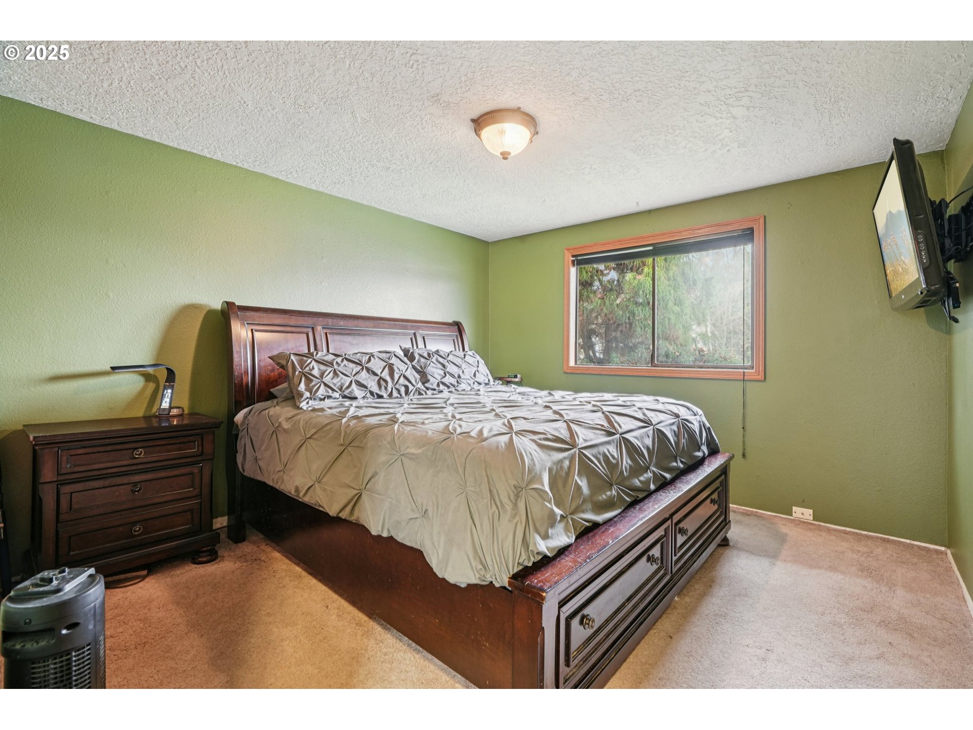 1832 Vine Court Forest Grove, OR 97116 - Photo 19 of 37 a bed sitting in a bedroom next to a window