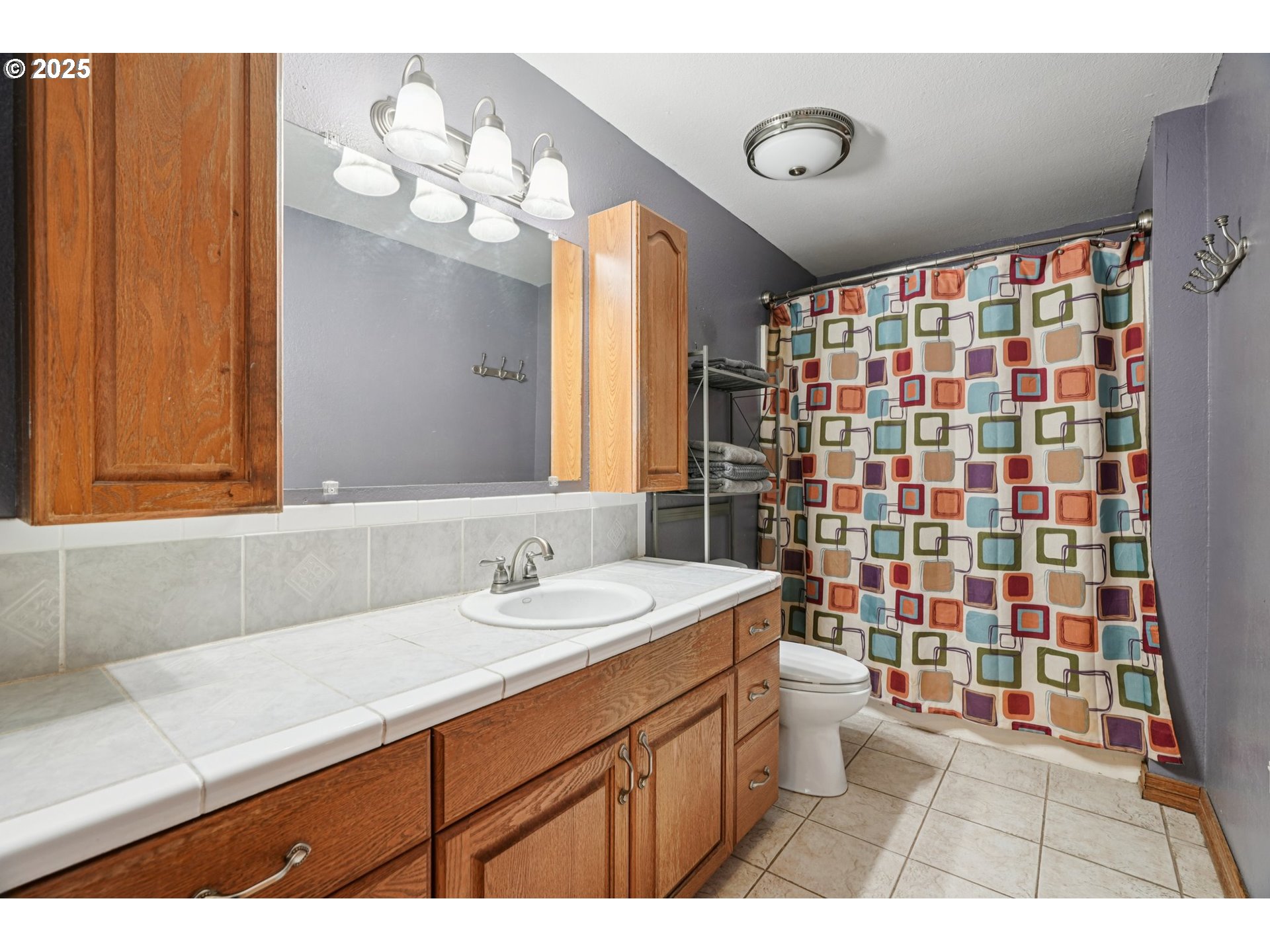 1832 Vine Court Forest Grove, OR 97116 - Photo 22 of 37 a bathroom with a sink a toilet and shower