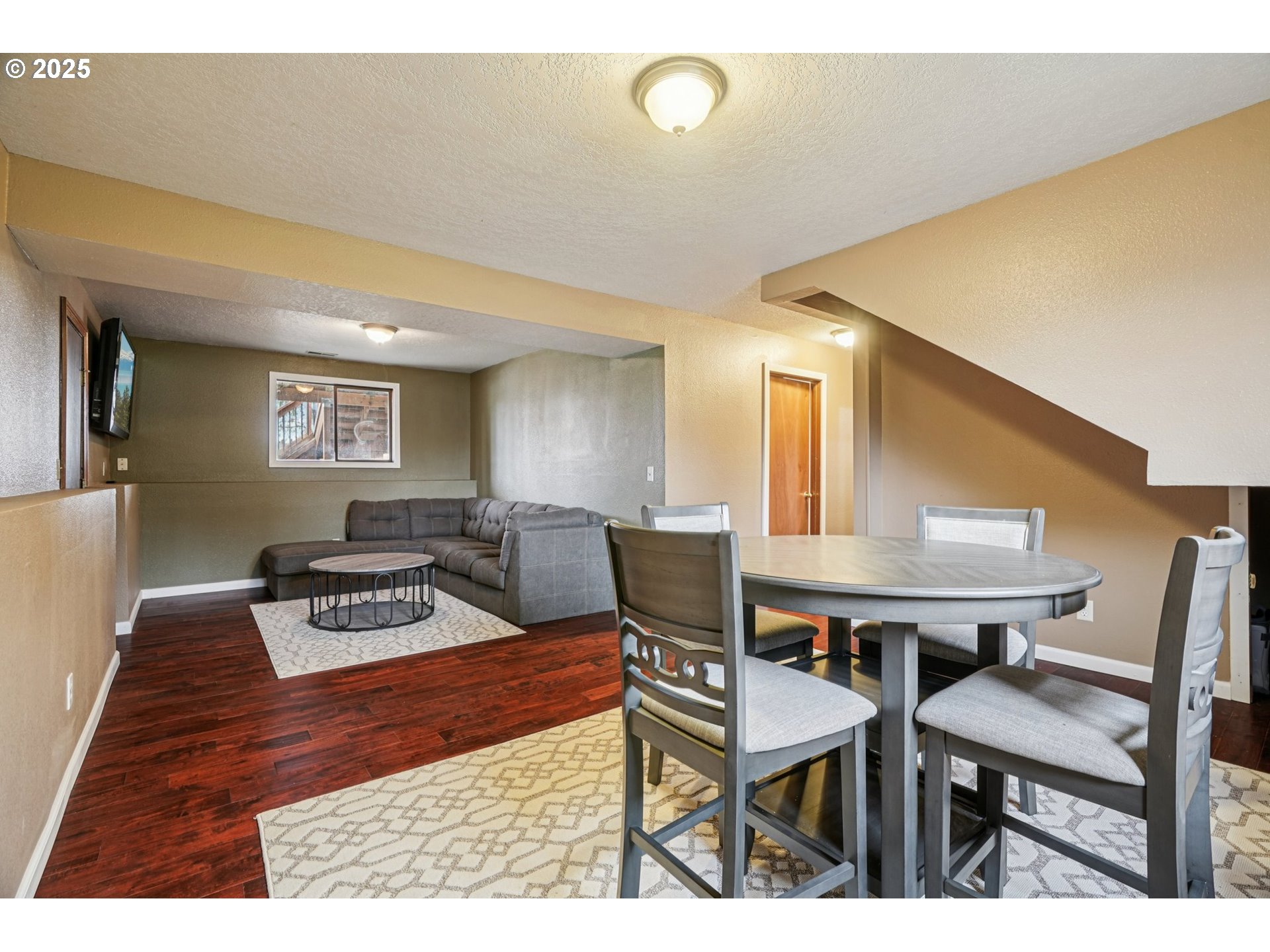 1832 Vine Court Forest Grove, OR 97116 - Photo 26 of 37 a living room with furniture and a wooden floor