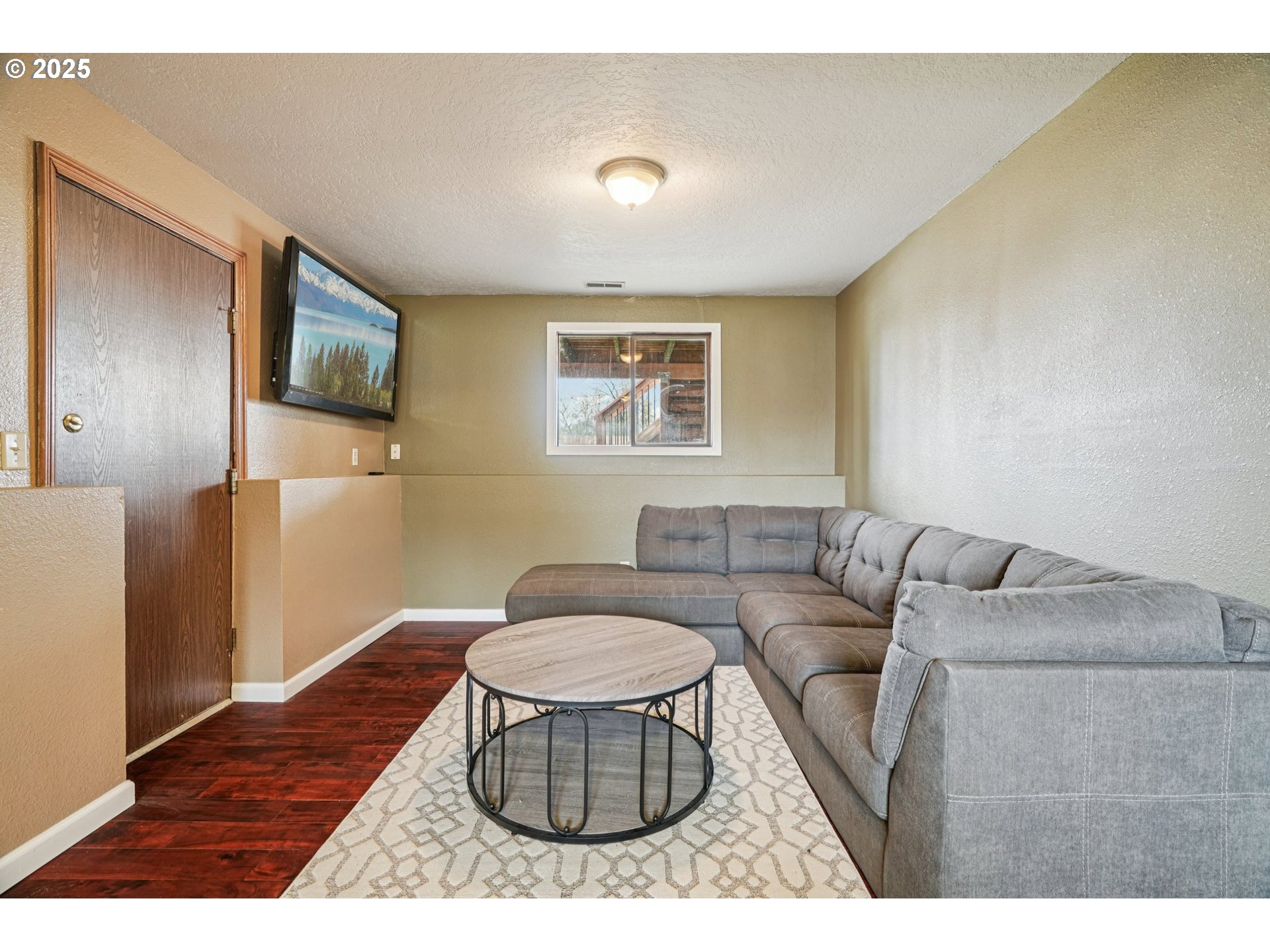 1832 Vine Court Forest Grove, OR 97116 - Photo 27 of 37 a living room with furniture and a flat screen tv