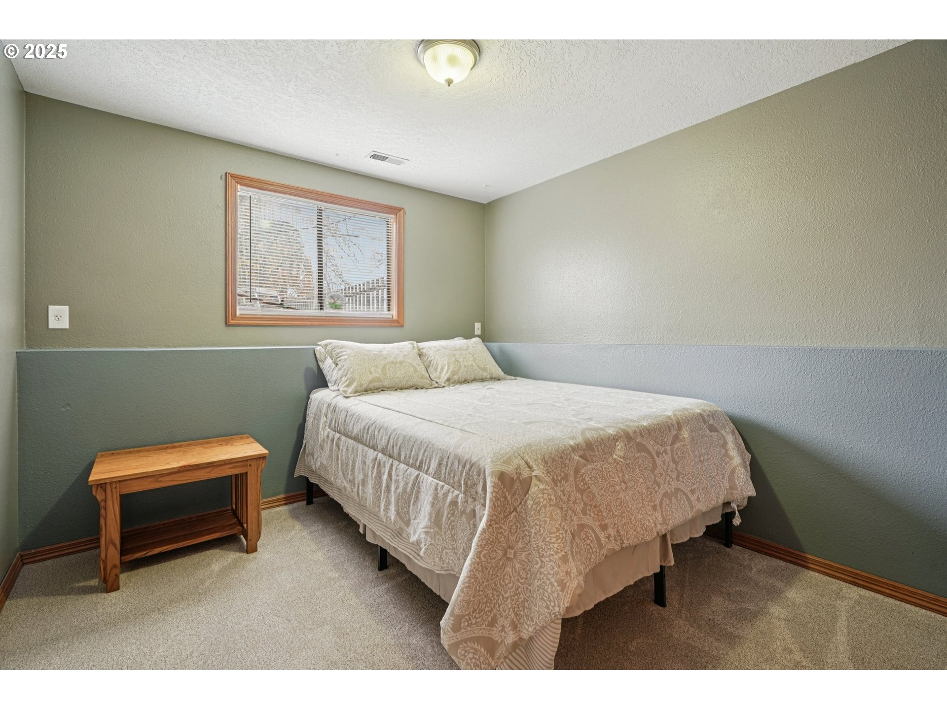 1832 Vine Court Forest Grove, OR 97116 - Photo 28 of 37 a bedroom with a bed table and chair