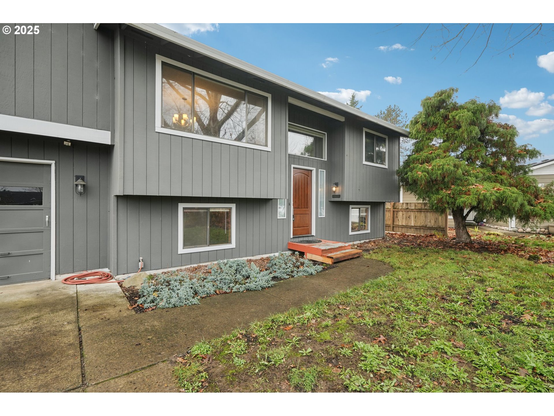 1832 Vine Court Forest Grove, OR 97116 - Photo 4 of 37 a front view of a house with a yard