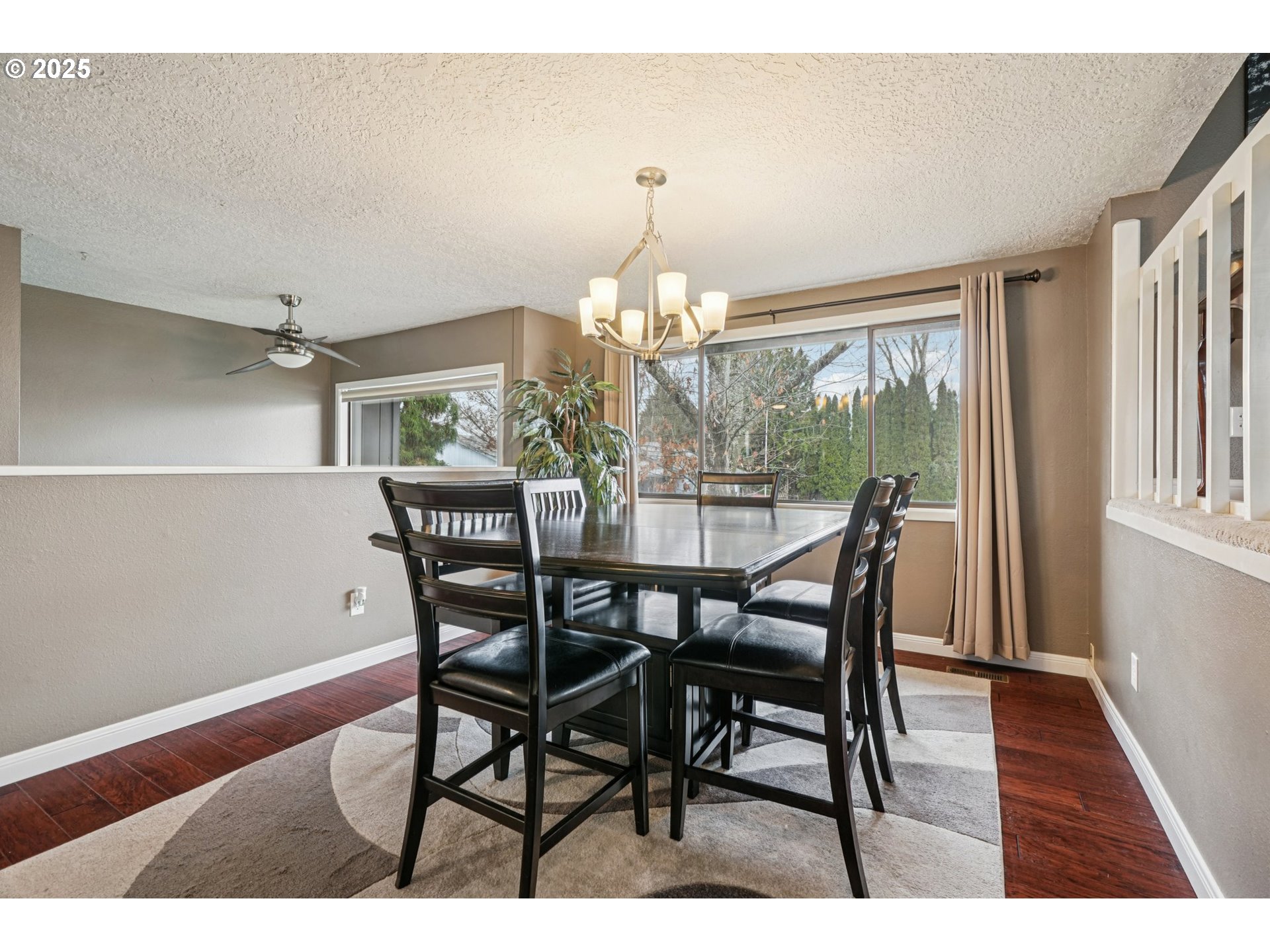 1832 Vine Court Forest Grove, OR 97116 - Photo 6 of 37 a dining room with furniture a chandelier and wooden floor