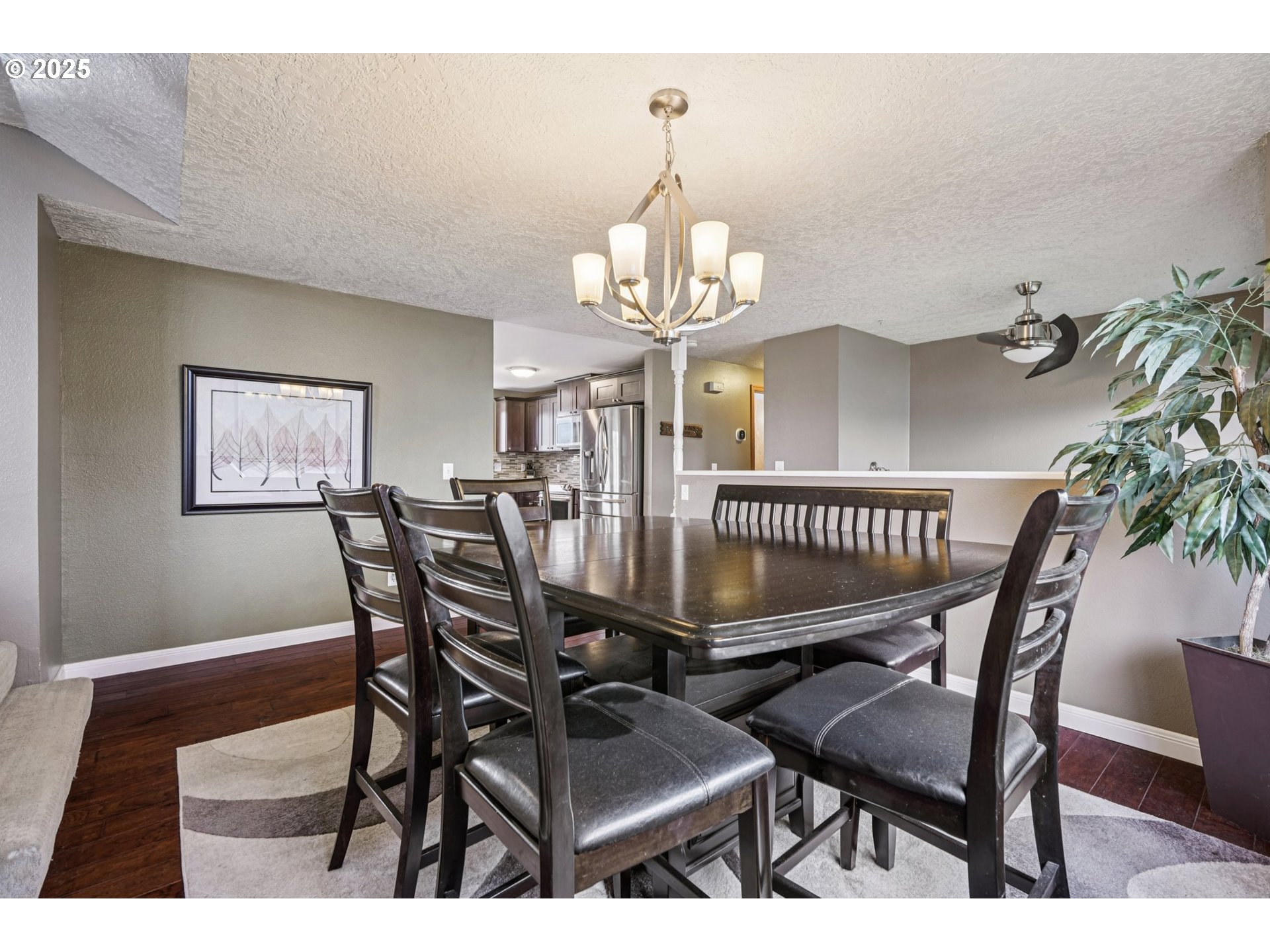 1832 Vine Court Forest Grove, OR 97116 - Photo 7 of 37 a view of a dining room with furniture and a chandelier