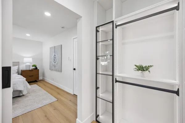 a living room with white walls and furniture