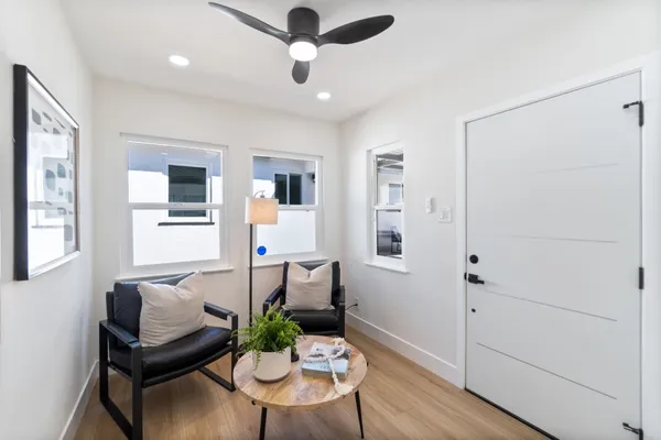 a kitchen with refrigerator and cabinets