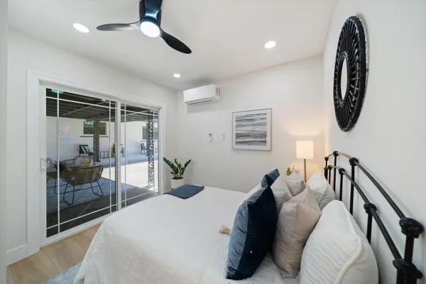 an aerial view of a house with a yard and large trees