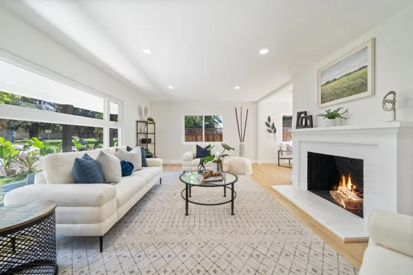 a living room with furniture and a fireplace