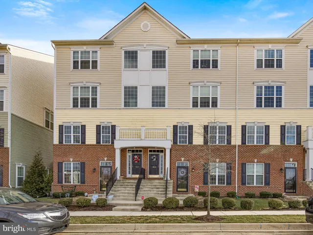a front view of a building with parking space