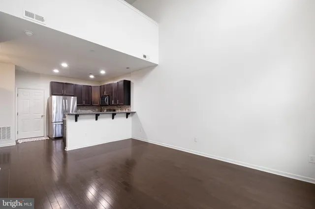 a view of kitchen with stainless steel appliances refrigerator and microwave
