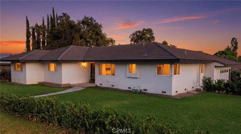 384 Colorado Street Arcadia, CA 91007 - Photo 1 of 51 a front view of house with yard and trees in the background