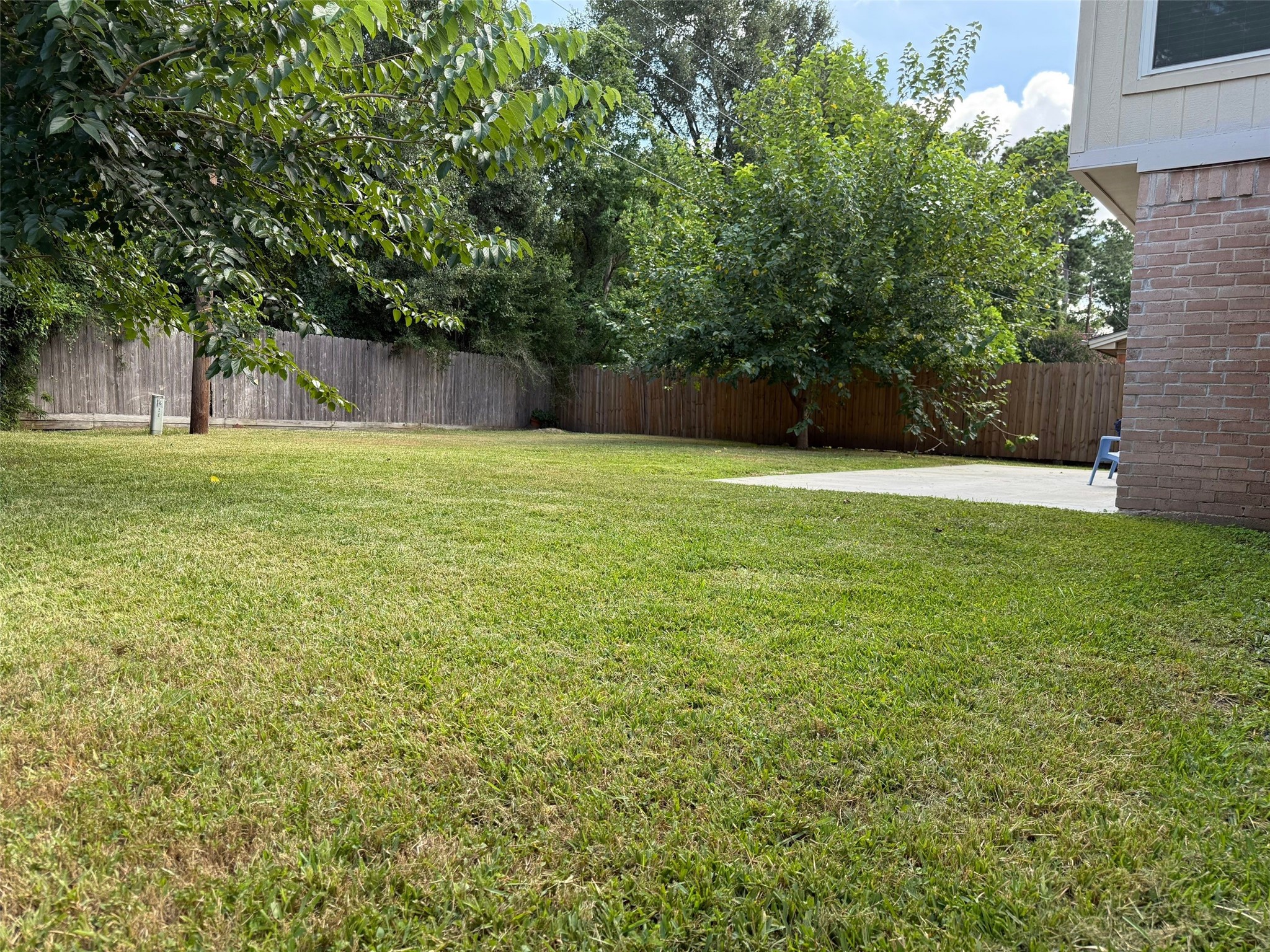 9626 Magnolia Ridge Drive Houston, TX 77070 - Photo 38 of 40 a view of a field of grass and trees