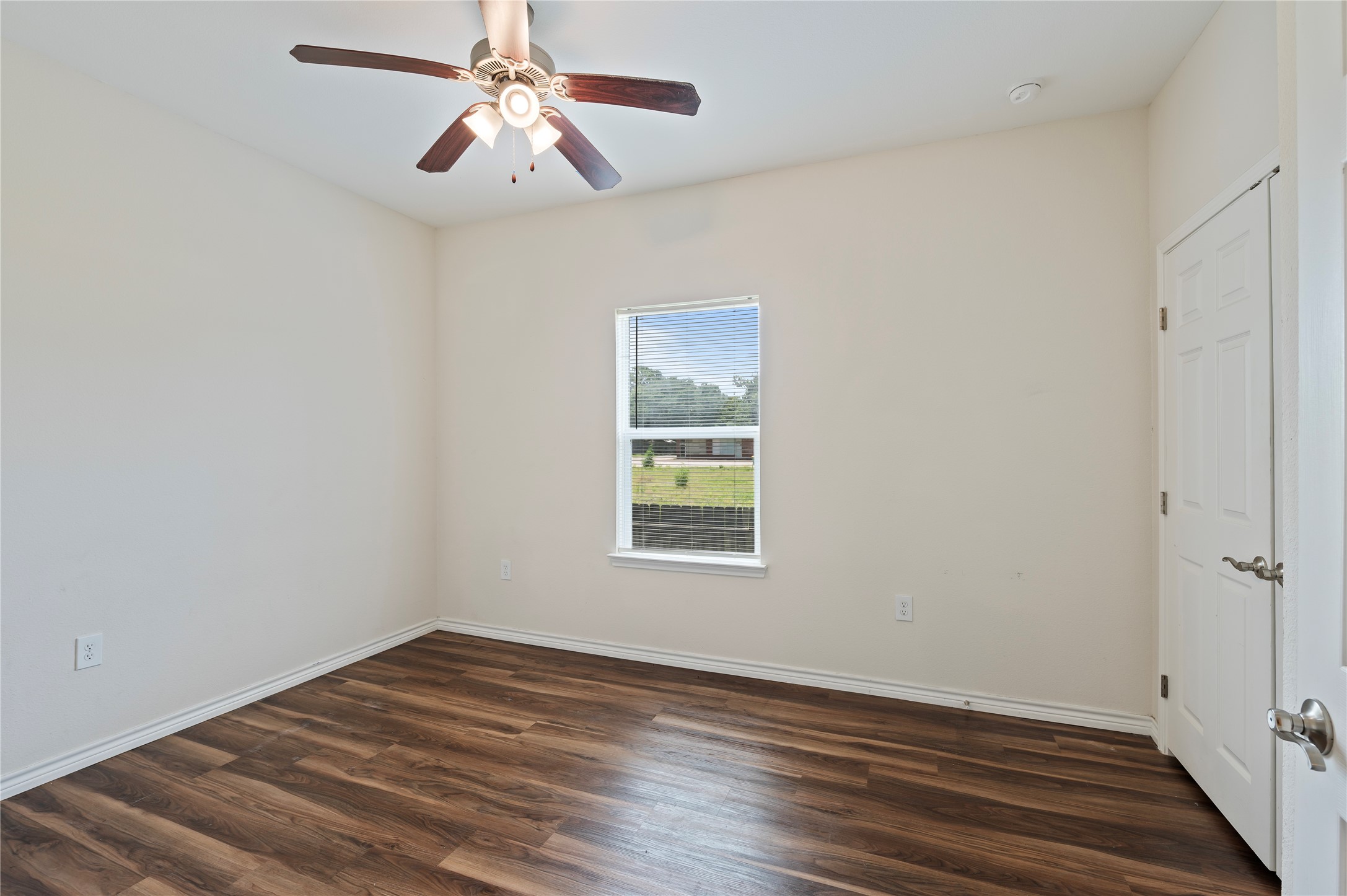 1125 Lake Road La Marque, TX 77568 - Photo 17 of 33 a view of empty room with wooden floor and fan