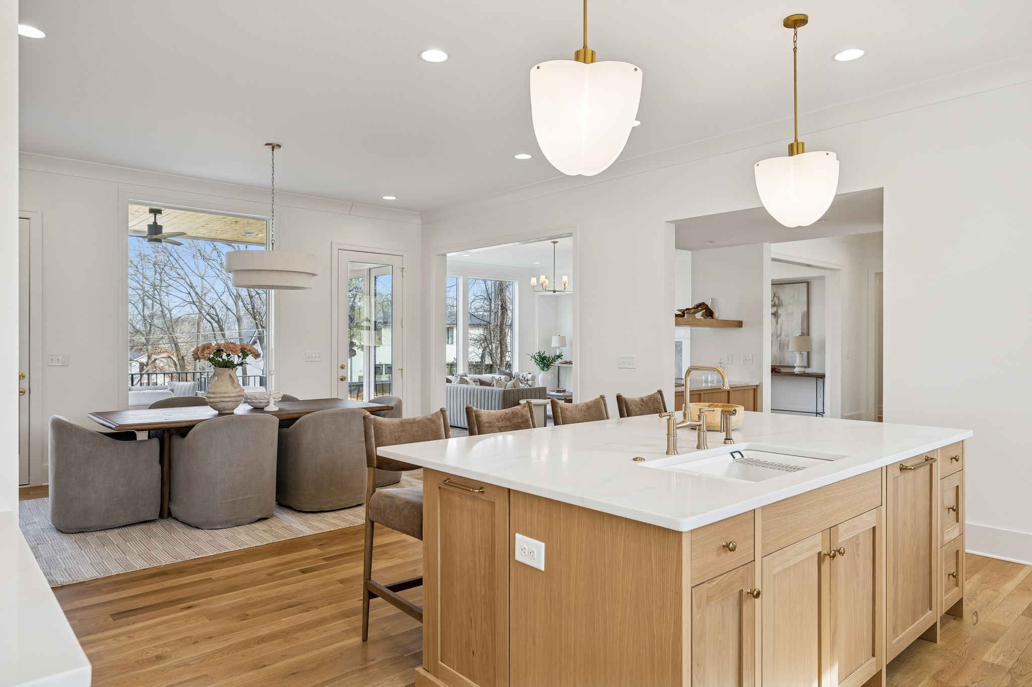 3510 Robin Road Nashville, TN 37204 - Photo 19 of 78 a kitchen with a sink dishwasher a dining table and chairs with wooden floor