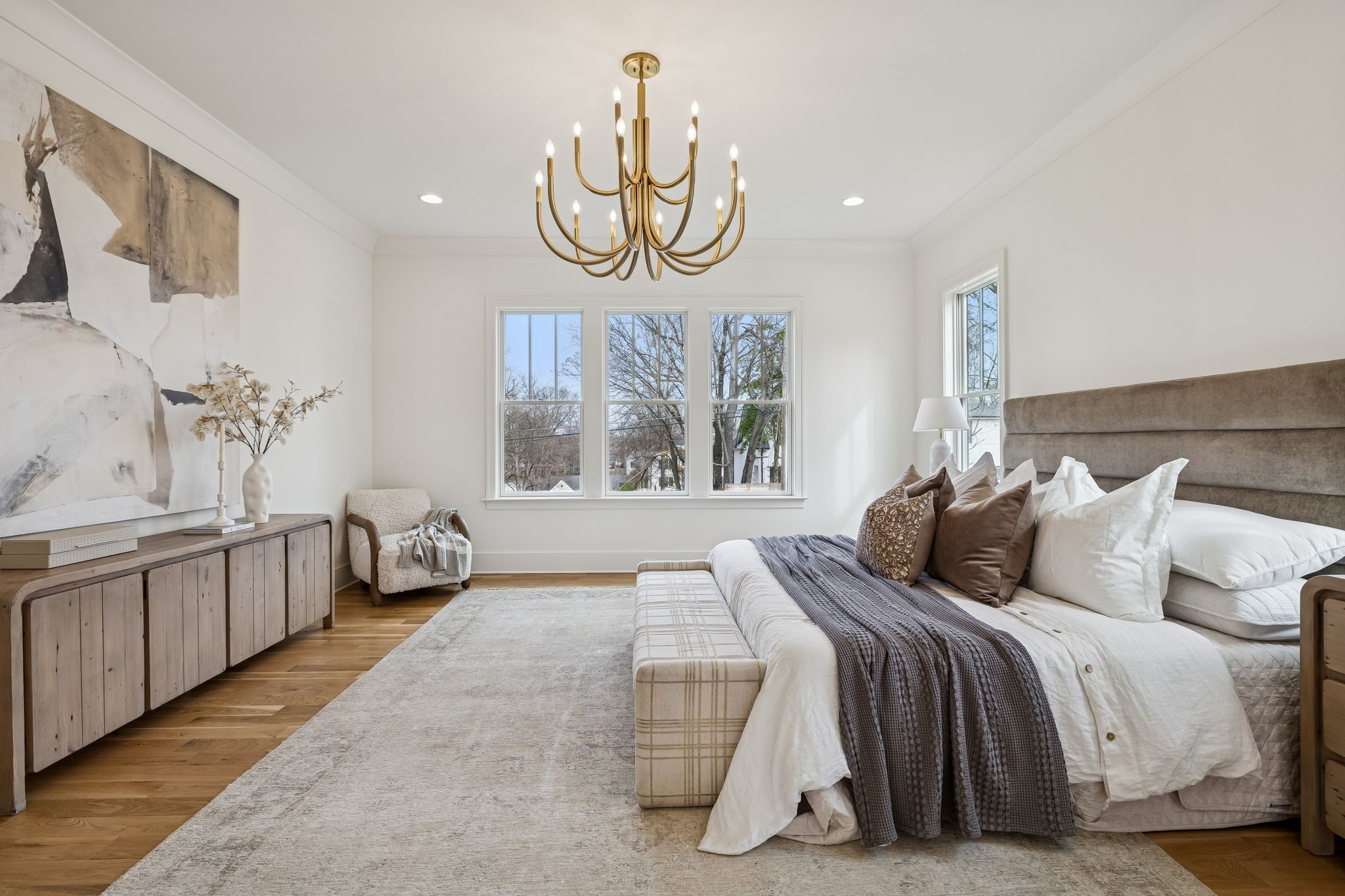 3510 Robin Road Nashville, TN 37204 - Photo 31 of 78 a bedroom with a large bed and a chandelier