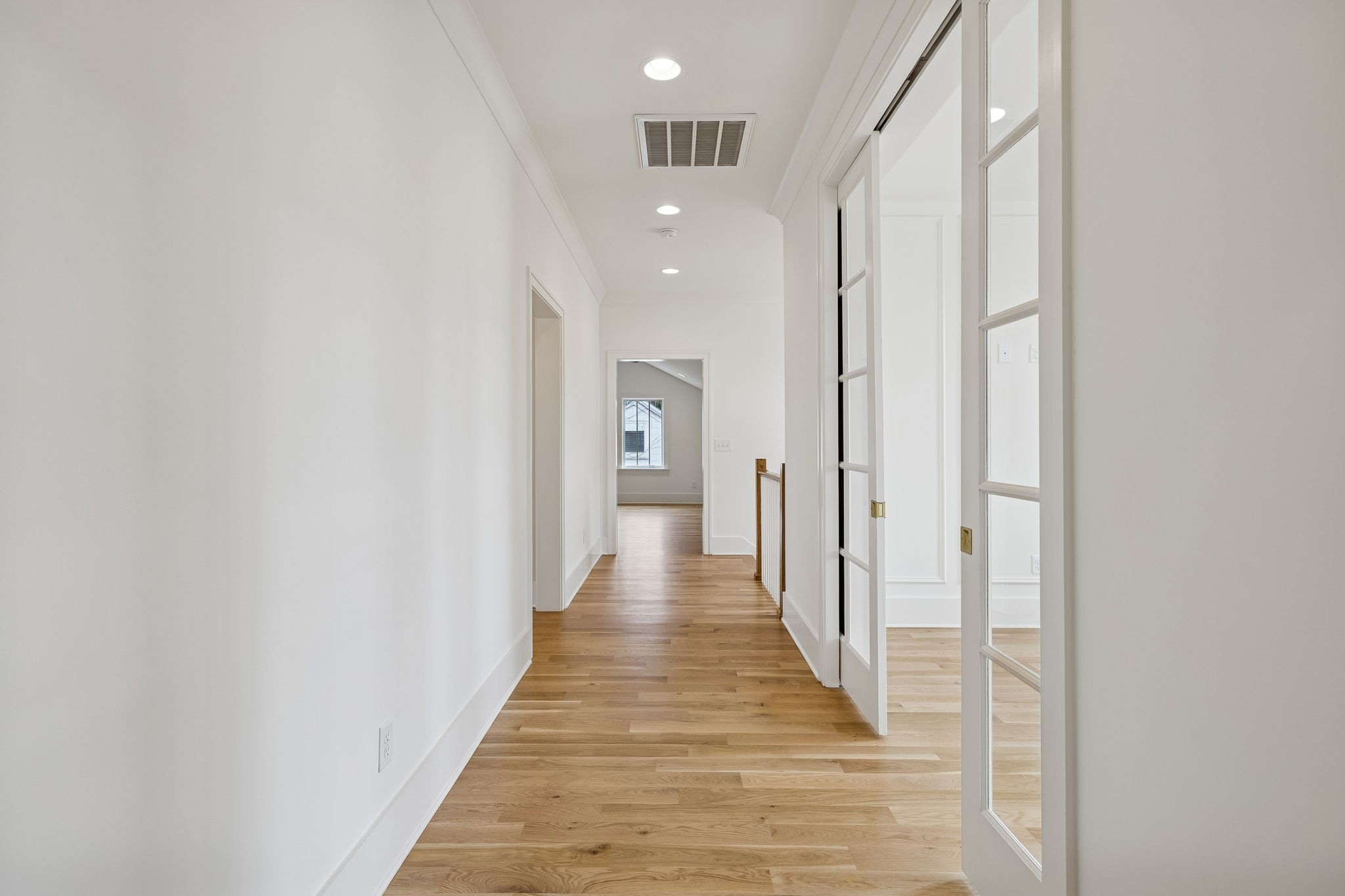 3510 Robin Road Nashville, TN 37204 - Photo 45 of 78 a view of a hallway with wooden floor and a bathroom