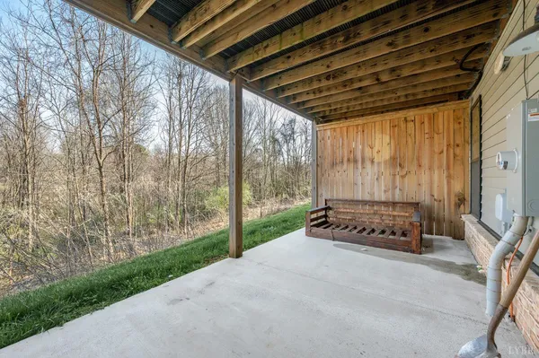 a kitchen with stainless steel appliances granite countertop a refrigerator a sink dishwasher a stove and white cabinets with wooden floor