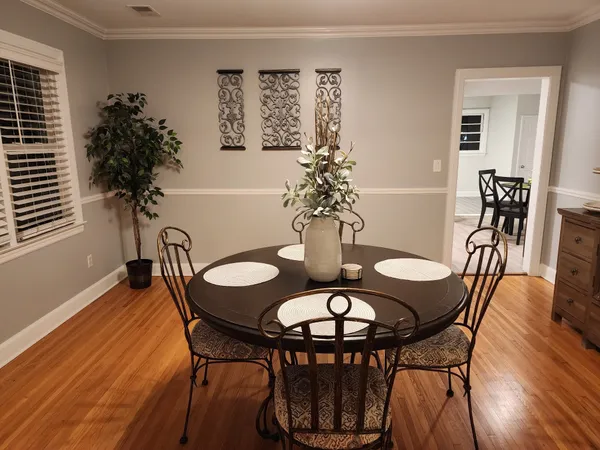 a living room with a large window and a table