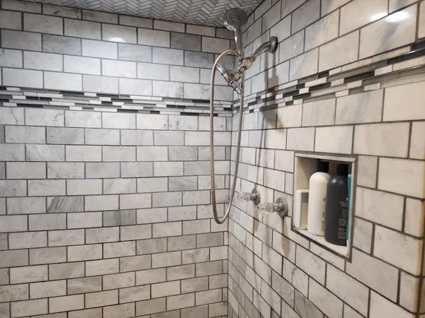 a bedroom with a bed and painting on the wall