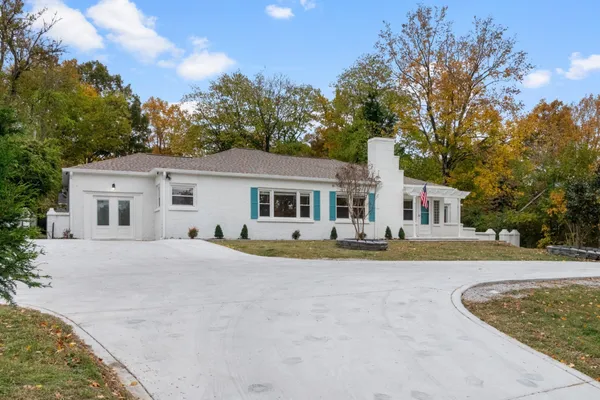 front view of a house with a big yard