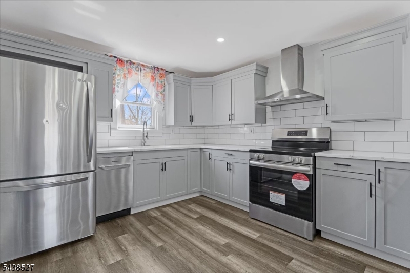83 Highway 15 Lafayette, NJ 07848 - Photo 3 of 20 a kitchen with stainless steel appliances a refrigerator sink and cabinets