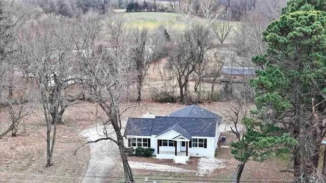 a view of a fountain in front of a house