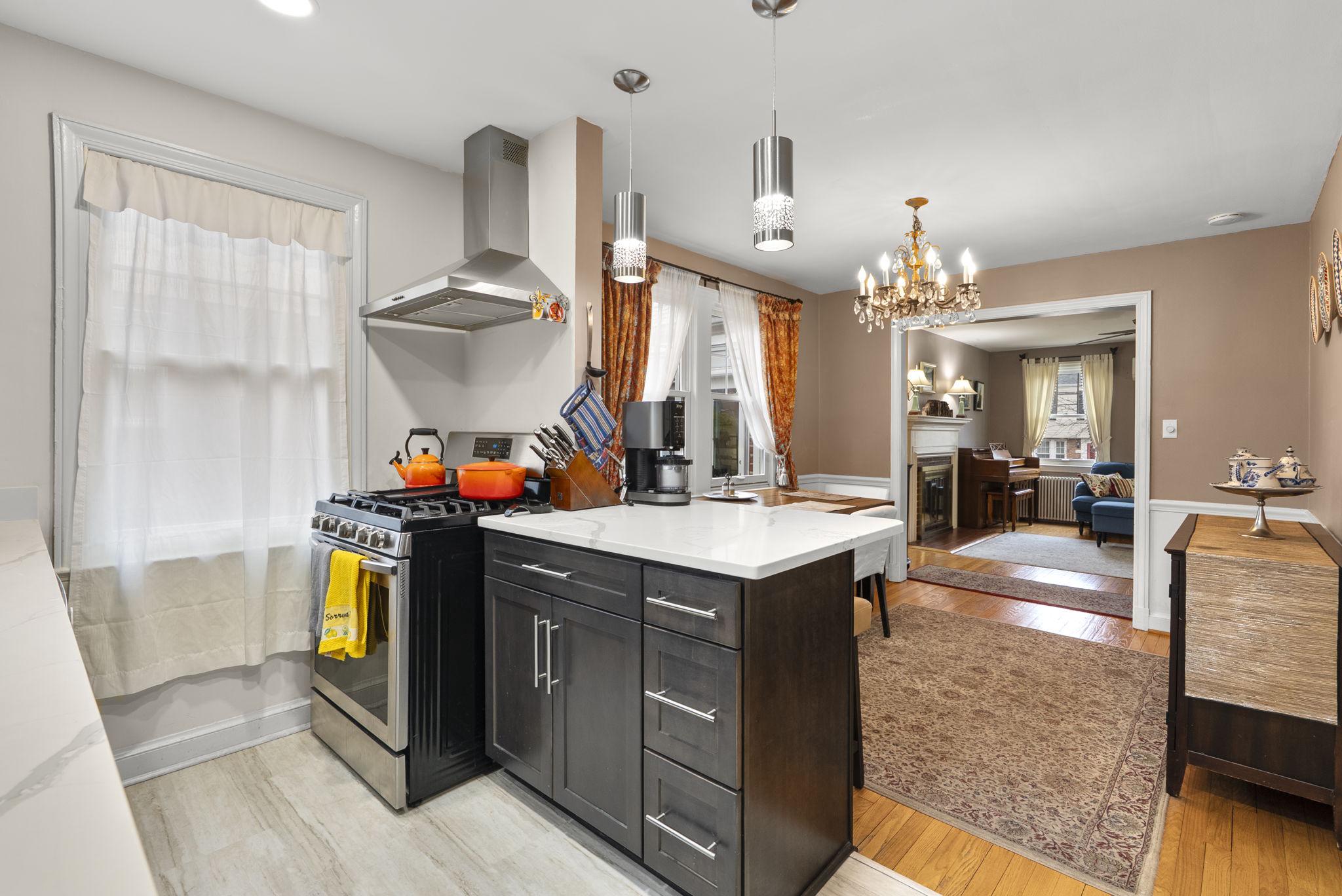 713 Gist Avenue Silver Spring, MD 20910 - Photo 11 of 35 a kitchen with stainless steel appliances granite countertop a stove and a refrigerator