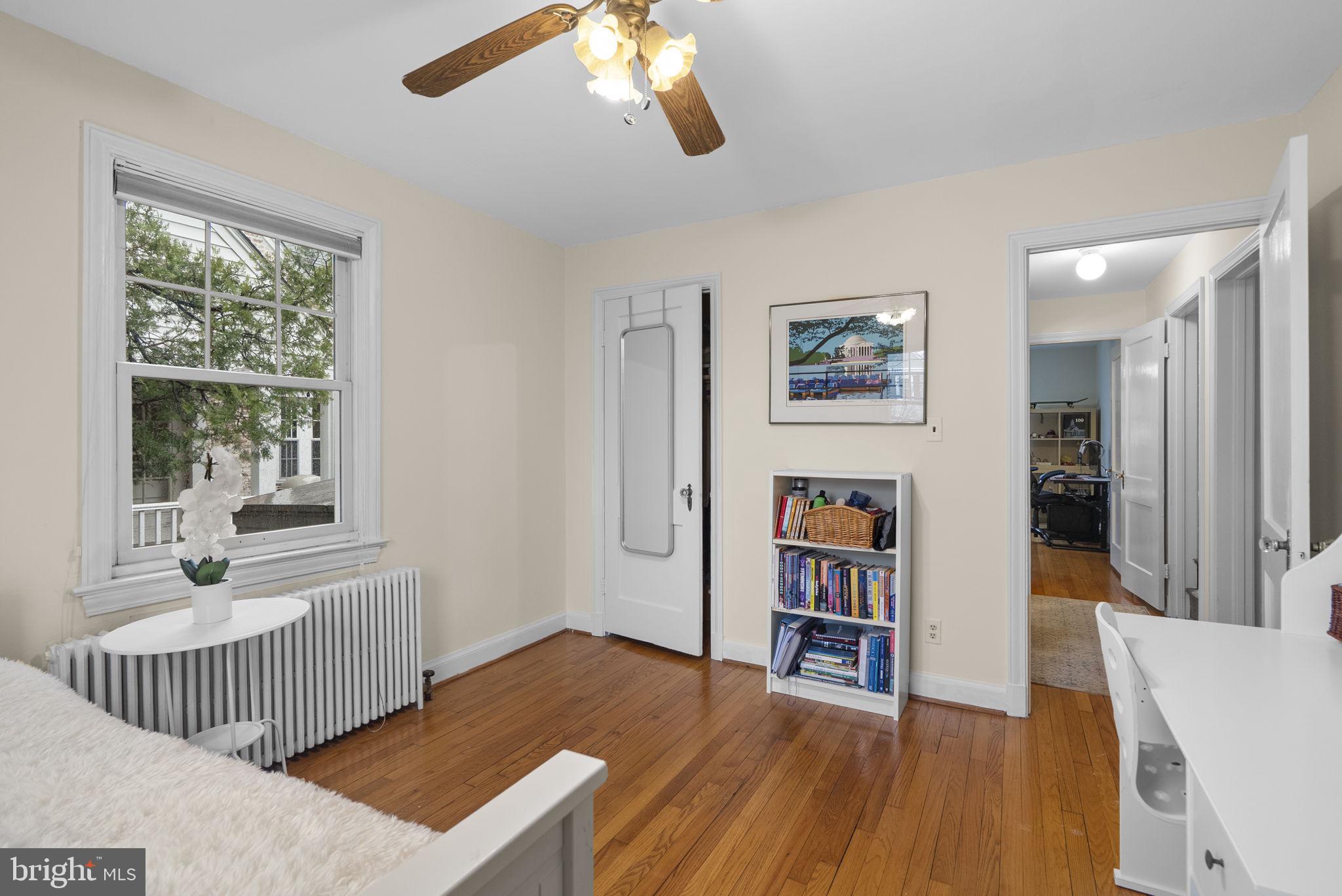 713 Gist Avenue Silver Spring, MD 20910 - Photo 14 of 35 a living room with wooden floor and a large window