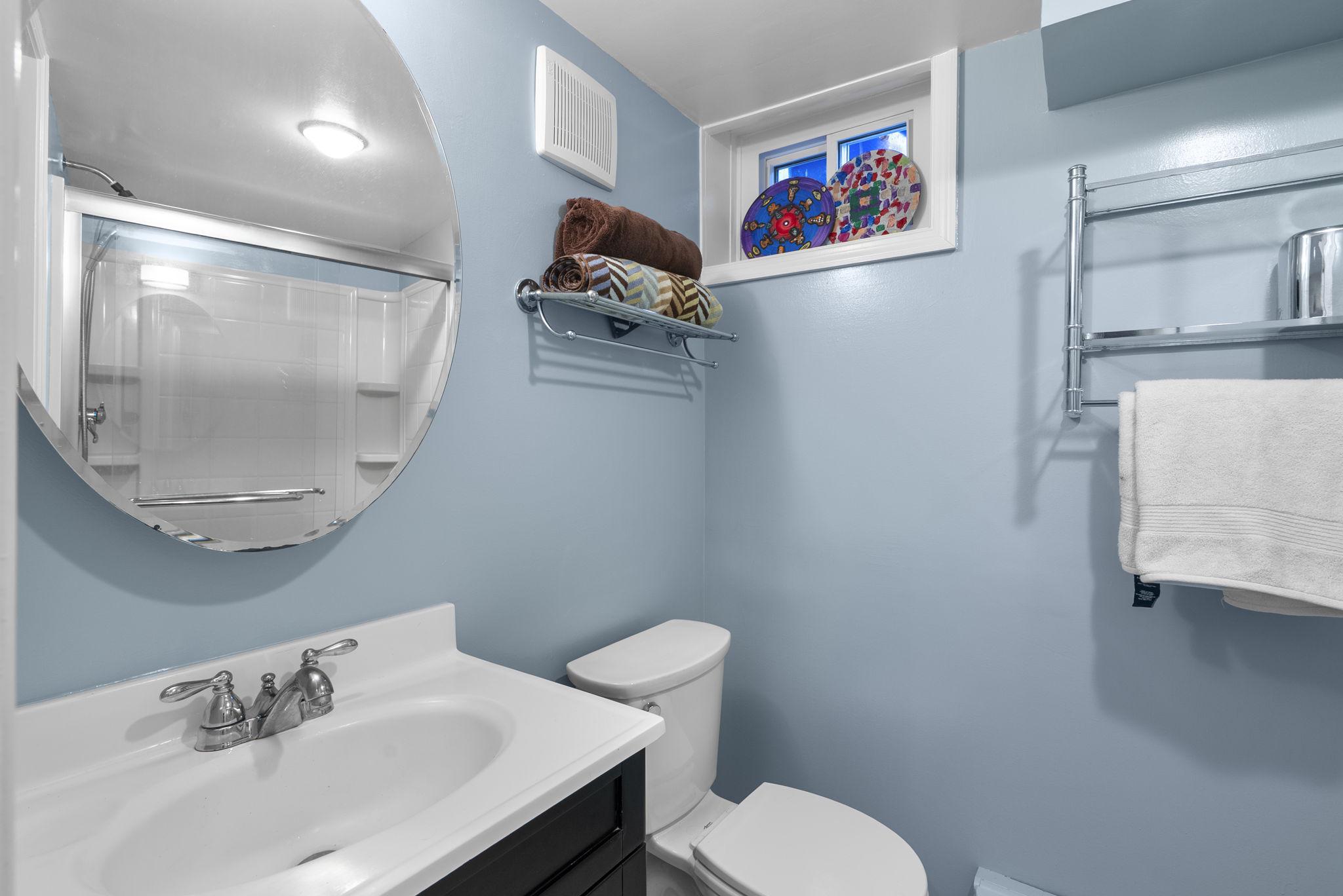 713 Gist Avenue Silver Spring, MD 20910 - Photo 23 of 35 a bathroom with a sink and a mirror