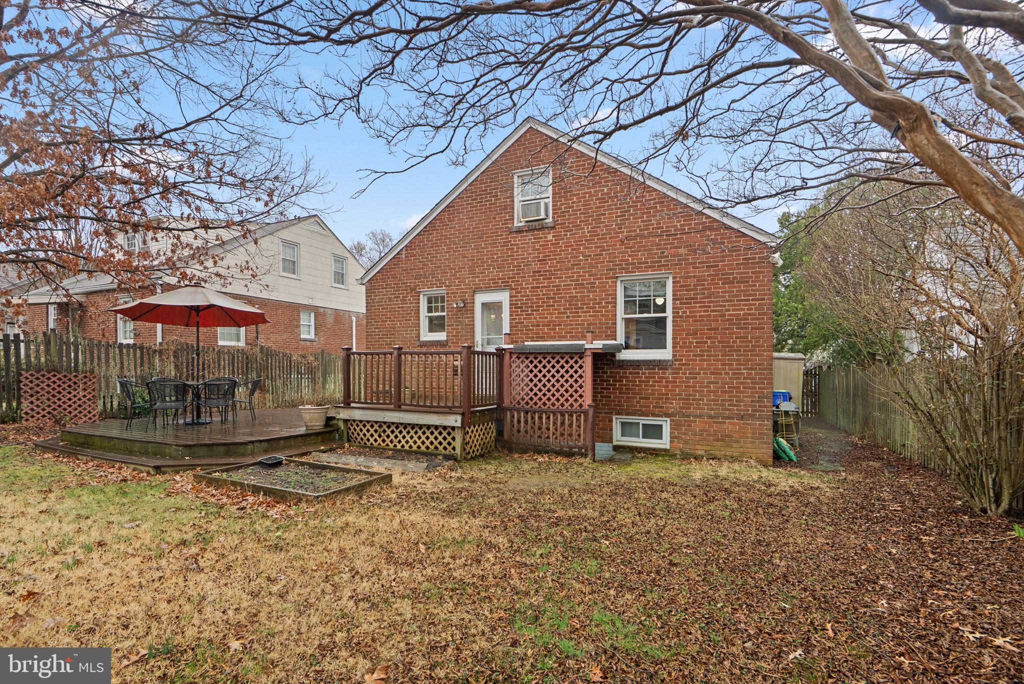 713 Gist Avenue Silver Spring, MD 20910 - Photo 29 of 35 a backyard of a house with table and chairs