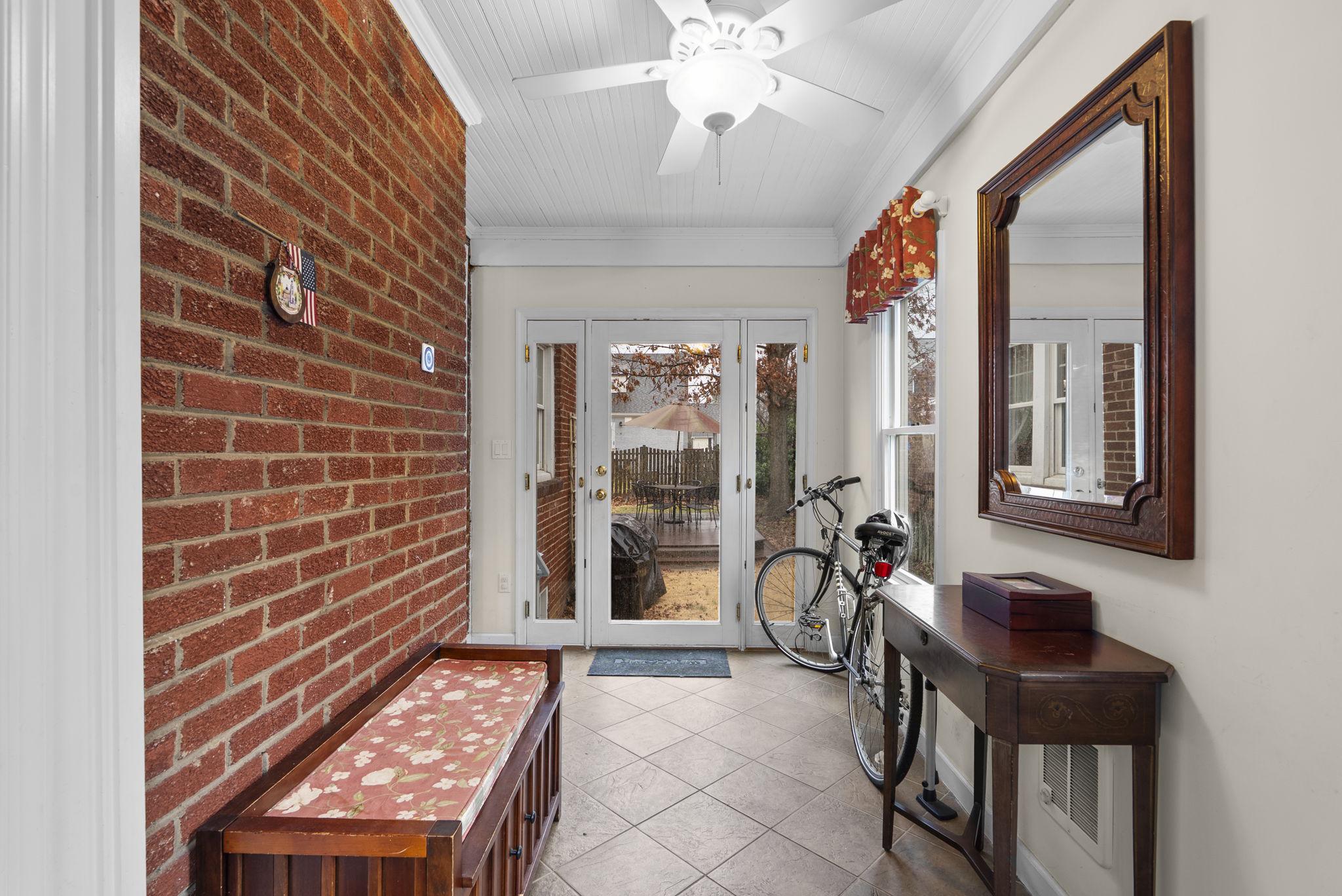 713 Gist Avenue Silver Spring, MD 20910 - Photo 4 of 32 Tiled foyer with exposed brick, coat closet