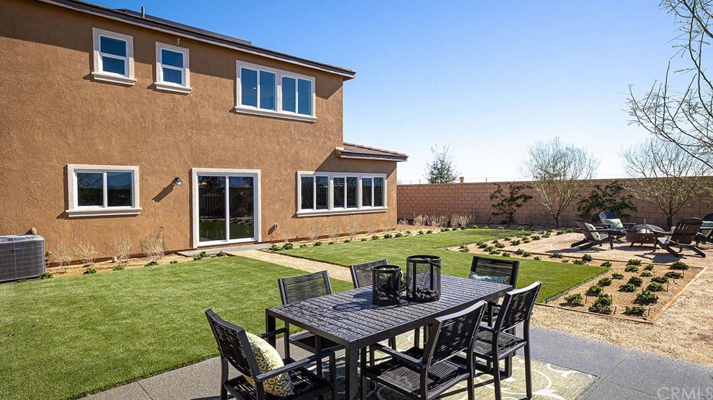 44324 Beringer Drive Indio, CA 92203 - Photo 2 of 14 a view of a house with backyard and sitting area
