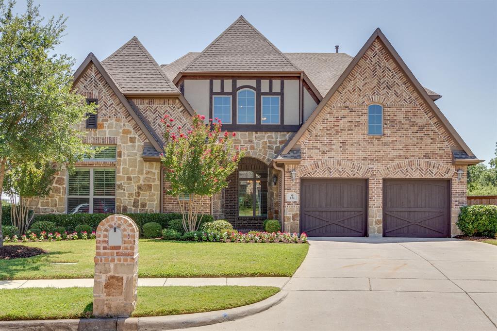 134 Santa Rosa Way Irving, TX 75062 - Photo 1 of 1 a front view of a house with a garden and plants