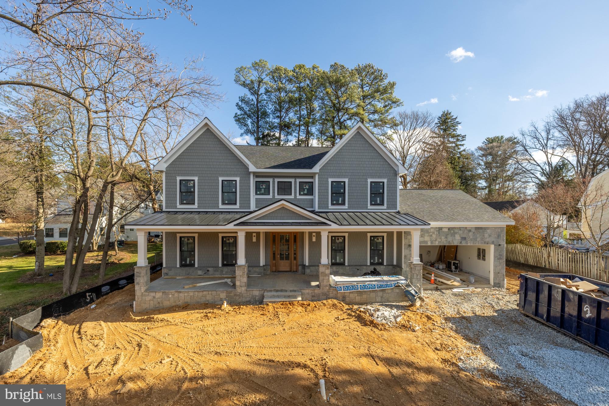 a front view of a house with a yard patio and fire pit