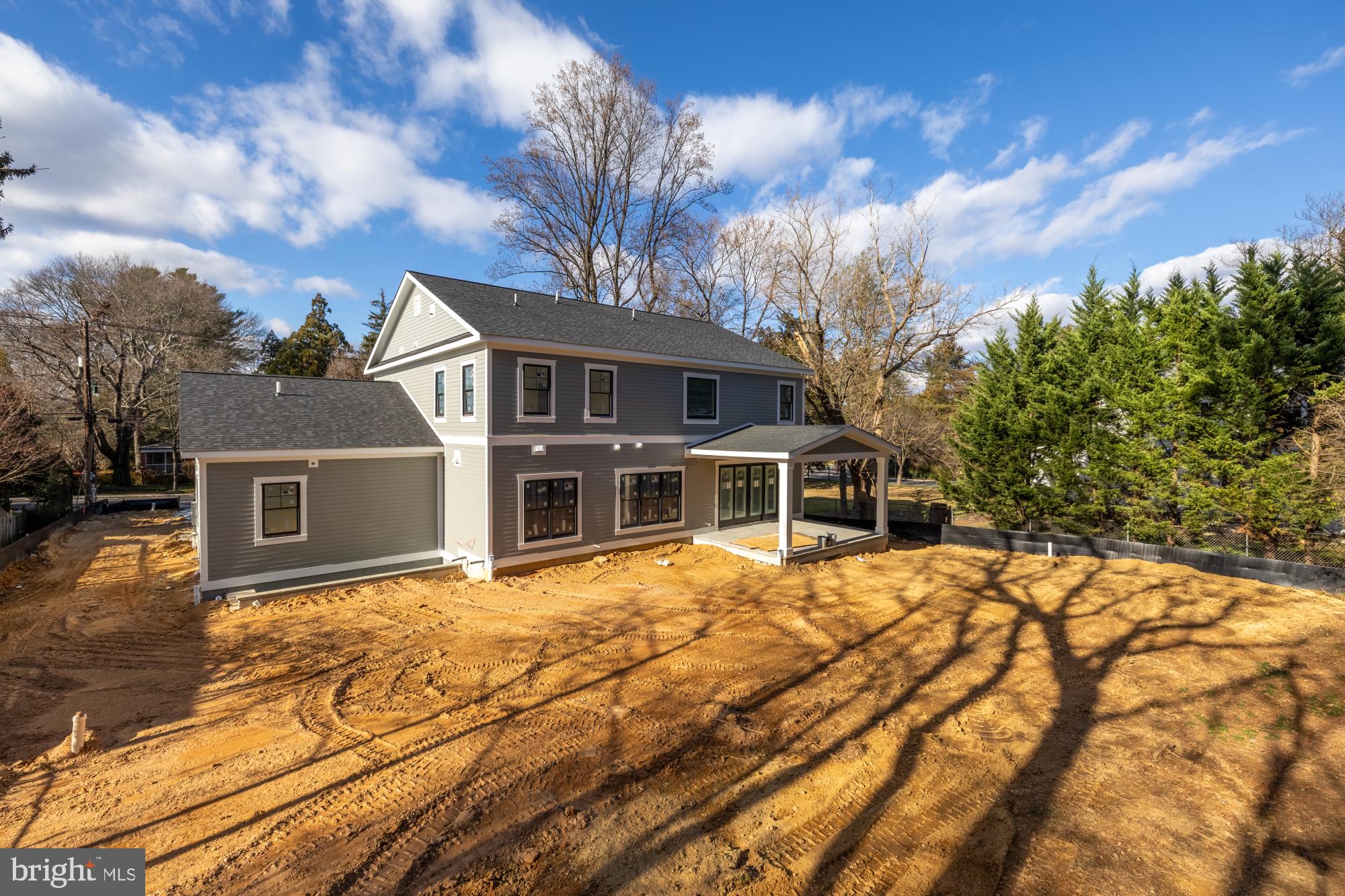 10105 Summit Avenue Kensington, MD 20895 - Photo 2 of 3 a front view of house with yard and trees around
