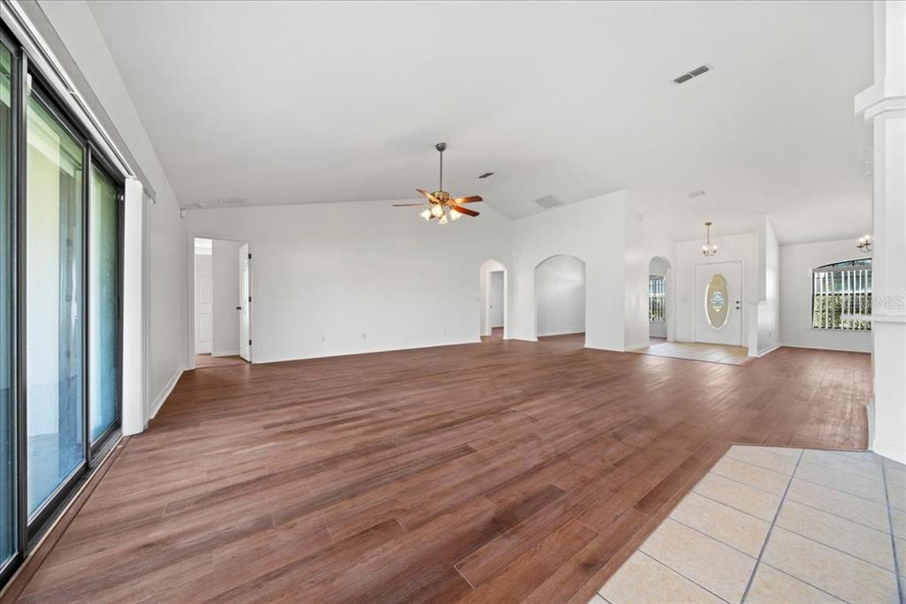 5659 Southwest 89th Place Ocala, FL 34476 - Photo 13 of 76 a view of a livingroom with wooden floor
