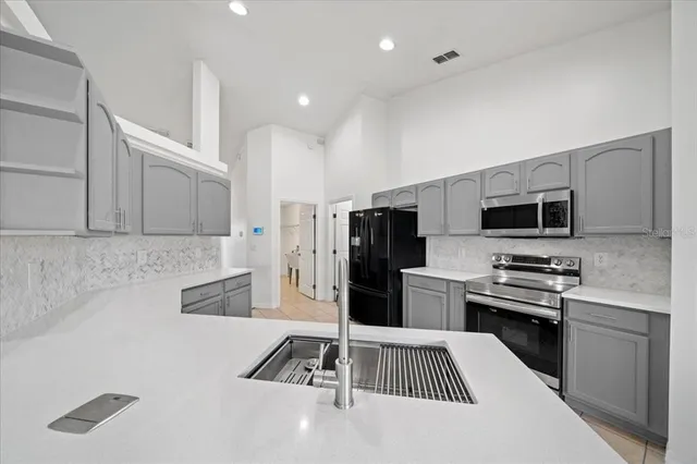 a bathroom with bathtub and window