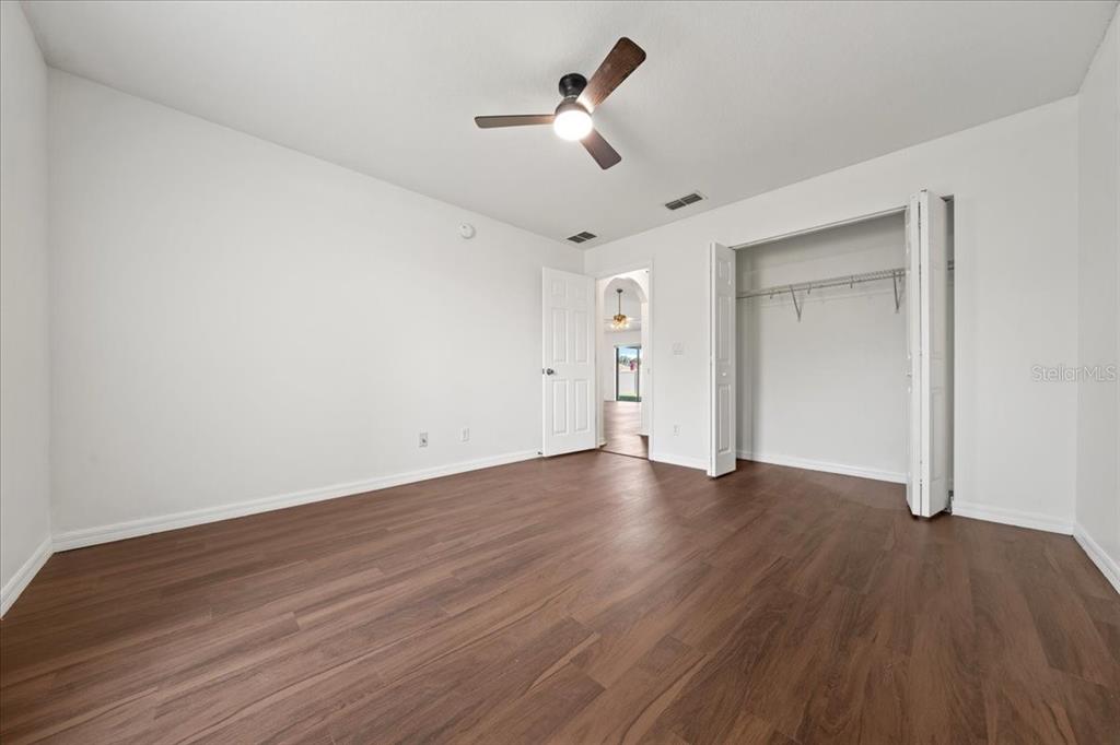 5659 Southwest 89th Place Ocala, FL 34476 - Photo 45 of 76 a view of empty room with wooden floor
