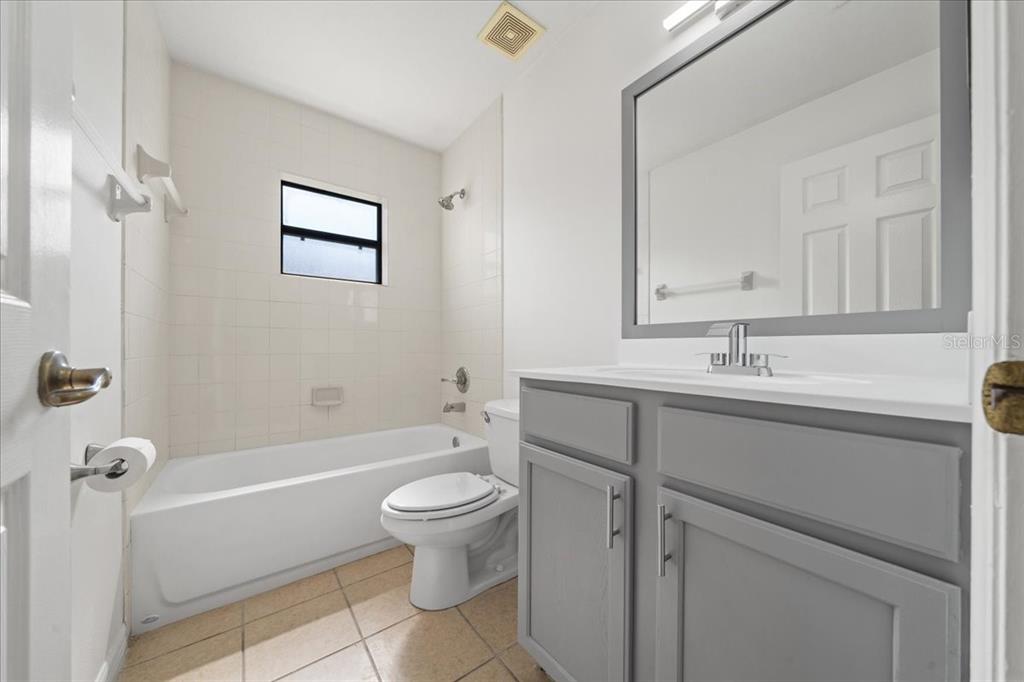 5659 Southwest 89th Place Ocala, FL 34476 - Photo 48 of 76 a bathroom with a sink a toilet and shower