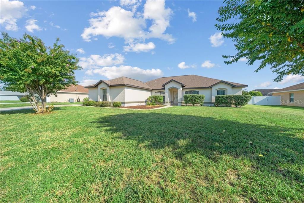5659 Southwest 89th Place Ocala, FL 34476 - Photo 60 of 76 a view of an house with backyard and garden