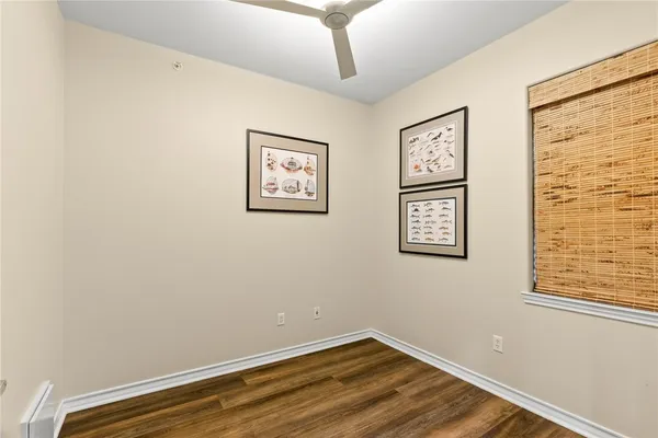 a view of a room with wooden floor and walls