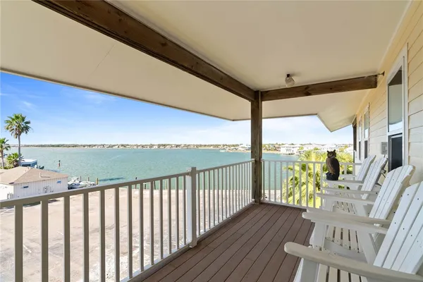 a view of balcony with furniture